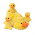 Four yellow plush duck toys, three smaller ones, and a larger one in the center with an embedded compartment for the smaller ducks.