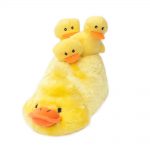 A plush duckling toy with a large duck at the base and three smaller ducklings attached on top.