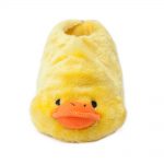 A fluffy yellow slipper designed to resemble a duck, featuring a duck's face with an orange bill at the front.