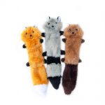 Three plush animal toys, resembling a fox, raccoon, and squirrel, are placed side by side against a plain white background.