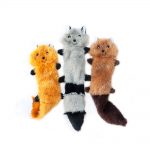 Three plush animal toys resembling a fox, raccoon, and red panda are displayed side by side on a white background.