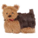 A small, soft toy dog with brown fur, a black body, and a red collar, against a white background.