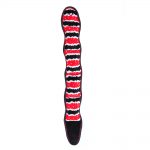 A long, snake-shaped dog toy with a red, black, and white pattern.
