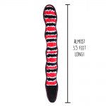 A long, wavy dog toy with black, red, and white stripes beside a vertical line showing its length, labeled "Almost 3.5 feet long!.