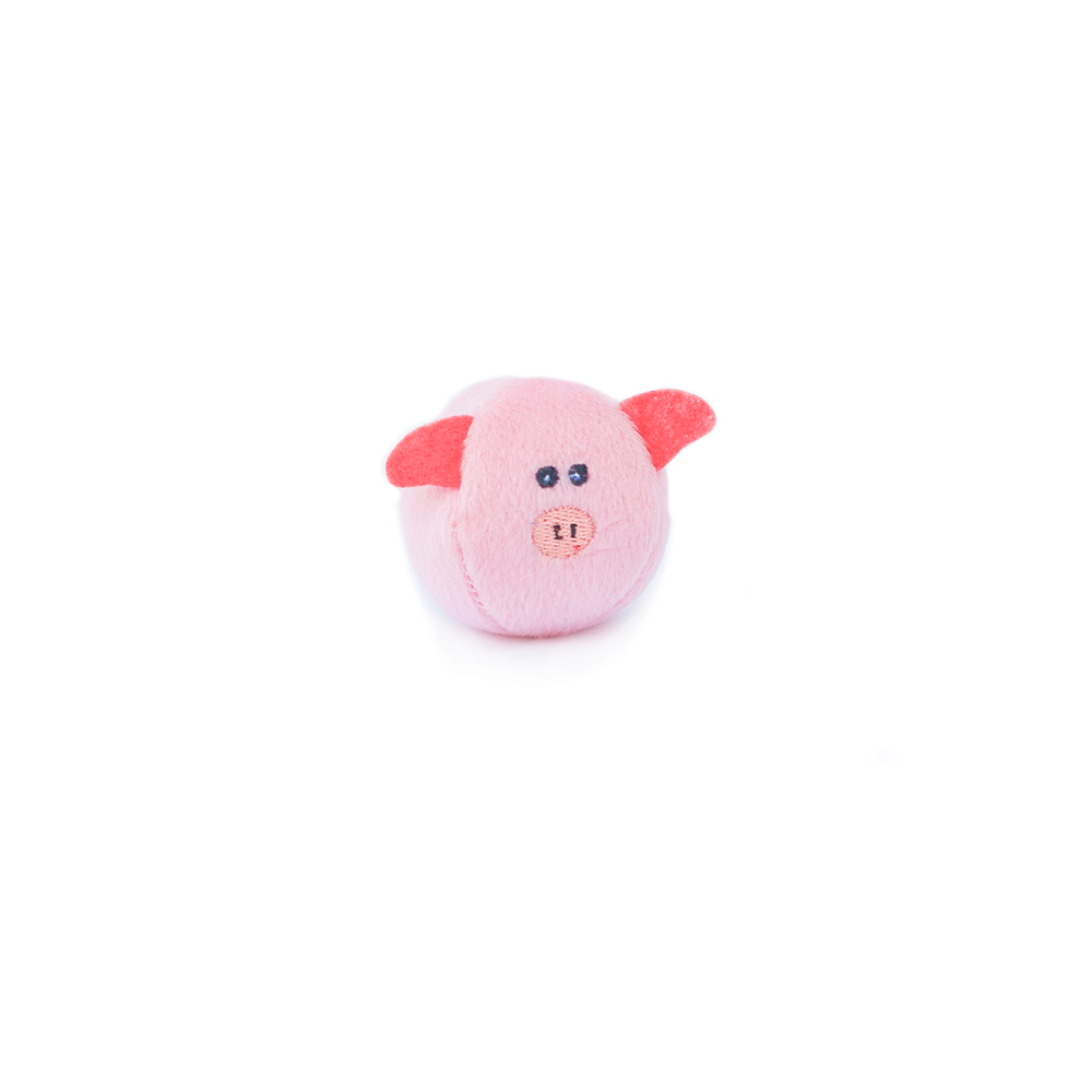 A small pink toy shaped like a pig with red ears and black eyes against a white background.