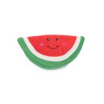 A plush toy shaped like a watermelon slice with a smiling face and rosy cheeks on the red part, surrounded by white and green sections.
