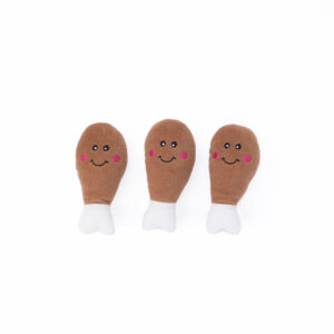 Three plush toys shaped like drumsticks with smiling faces and pink cheeks against a white background.