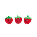 Three small, red, plush toys shaped like strawberries with green tops and smiling faces are placed side by side against a white background.