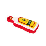 A plush toy shaped like a red and yellow bottle with a cactus drawing and the word "TEQUILA" on the label.