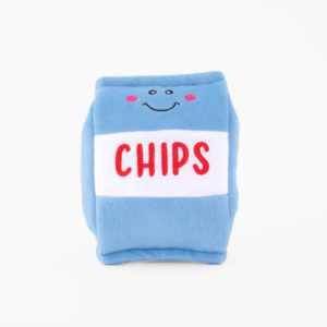 A blue plush toy in the shape of a chips bag with a smiling face and the word "CHIPS" written in red on a white strip.