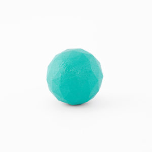 A turquoise, faceted rubber ball labeled "Zogoflex" against a white background.