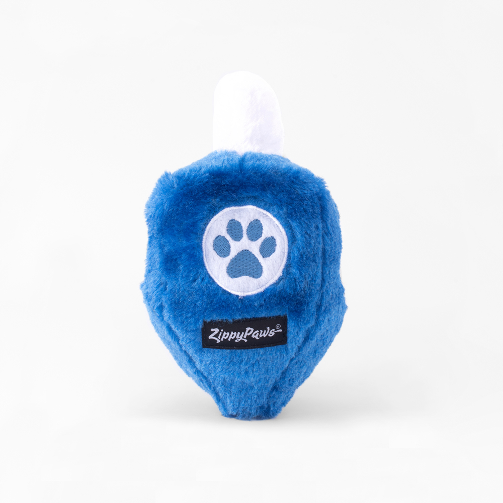 A blue plush dog toy with a white paw print emblem and a black label that reads 