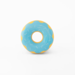 A rubber donut-shaped toy with a light blue surface, white sprinkles, and a yellow wavy pattern along the edge. The toy is centered on a white background.