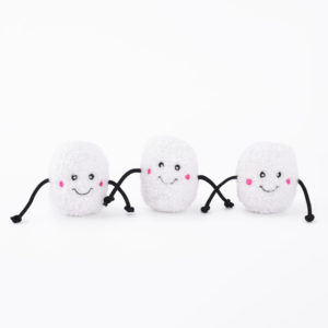 Three plush toys shaped like marshmallows with happy faces and black string arms and legs, positioned side by side on a white background.