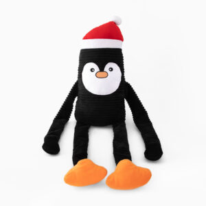 Plush toy penguin with a black body, long black limbs, orange feet, a white face, and a red Santa hat, seated against a white background.