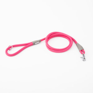 A coiled, pink dog leash made of rope with a metal clip at one end and a loop handle at the other against a white background.