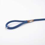 A blue and white speckled rope dog leash with a metal ring and a leather accent on a white background.