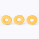 Three yellow doughnut-shaped plush toys arranged in a horizontal line against a plain white background.
