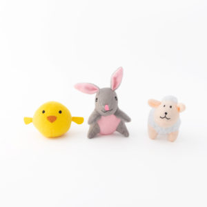 A yellow plush chick, a gray plush rabbit with pink ears, and a white plush sheep with a smiling face are placed in a row on a white background.