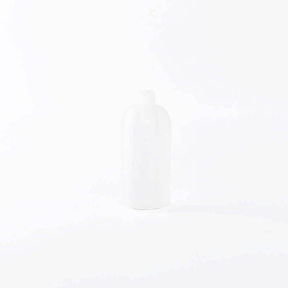 A plain, white, cylindrical plastic bottle with a screw cap, shown against a white background.