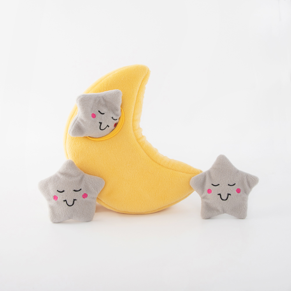 A yellow crescent moon plush and two gray star plushes with embroidered smiling faces and rosy cheeks on a white background.
