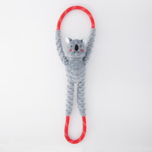A plush gray koala toy with a red and white polka-dotted elongated loop at both ends, laid flat on a white background.