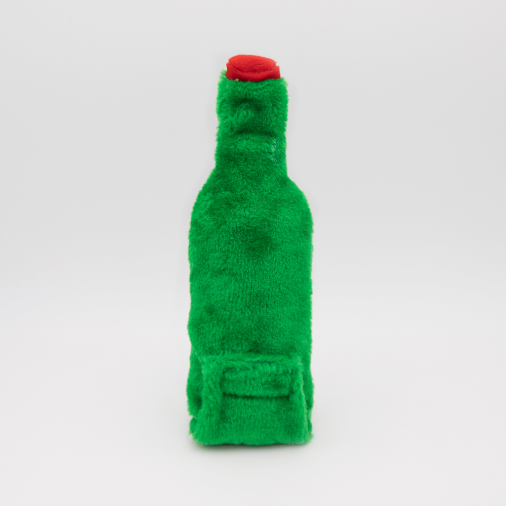 A green plush toy shaped like a bottle with a red cap, set against a plain white background.