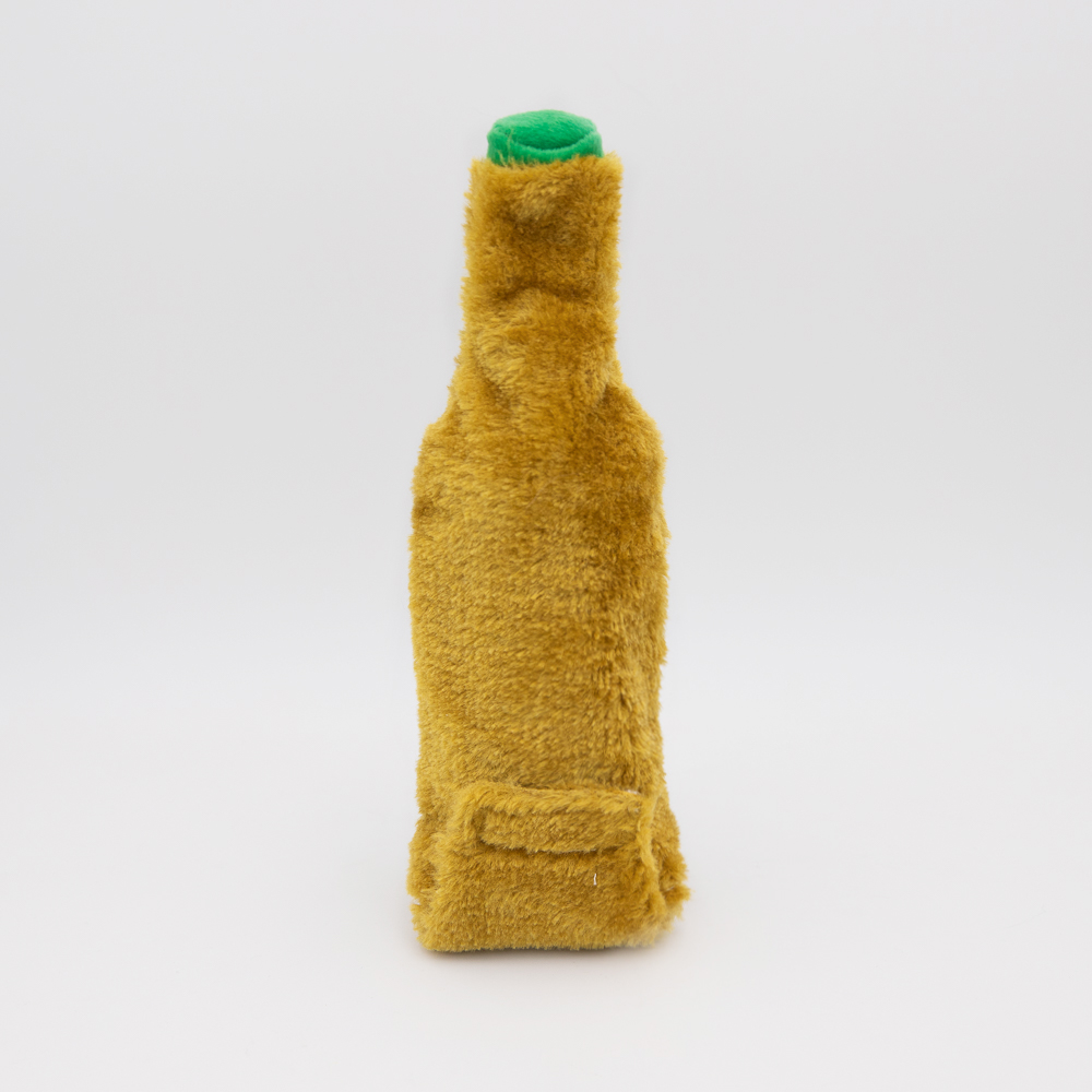 A fuzzy, yellow bottle-shaped object with a green top and a small pocket at the bottom, on a white background.