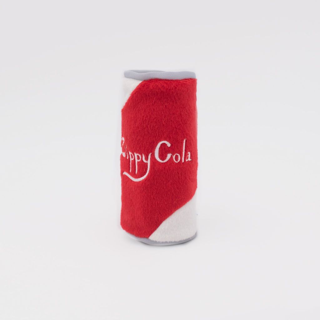 A cylindrical red and white plush toy resembling a soda can with 