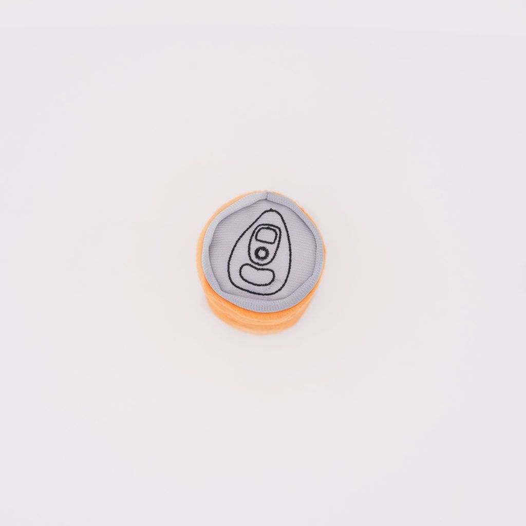 A circular fabric patch with an embroidered image of a soda can's pull tab. The patch features a gray background and orange border.