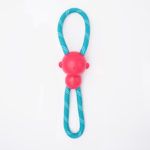 A red rubber ball attached to a looped blue rope with white accents, designed as a dog toy.
