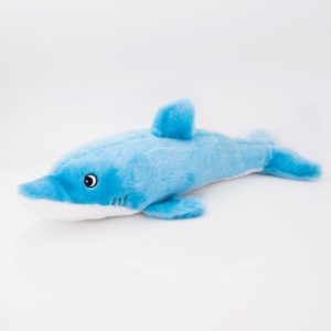 A blue and white plush toy dolphin lying on a plain white background.