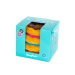 A teal box with a transparent window displays three plush donuts stacked vertically in pink, blue, and yellow colors by ZippyPaws.