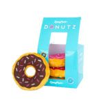 A blue box labeled "Zippy Paws Donutz" containing two plush donut toys and one plush donut toy with chocolate icing and sprinkles displayed outside the box.