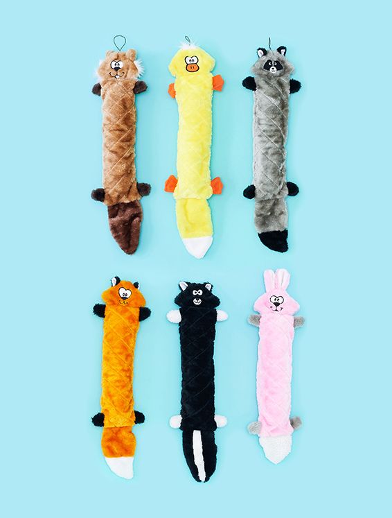 Six plush toys shaped like long, quilted animals are displayed vertically against a light blue background. The toys include designs resembling a bear, duck, raccoon, fox, skunk, and rabbit.