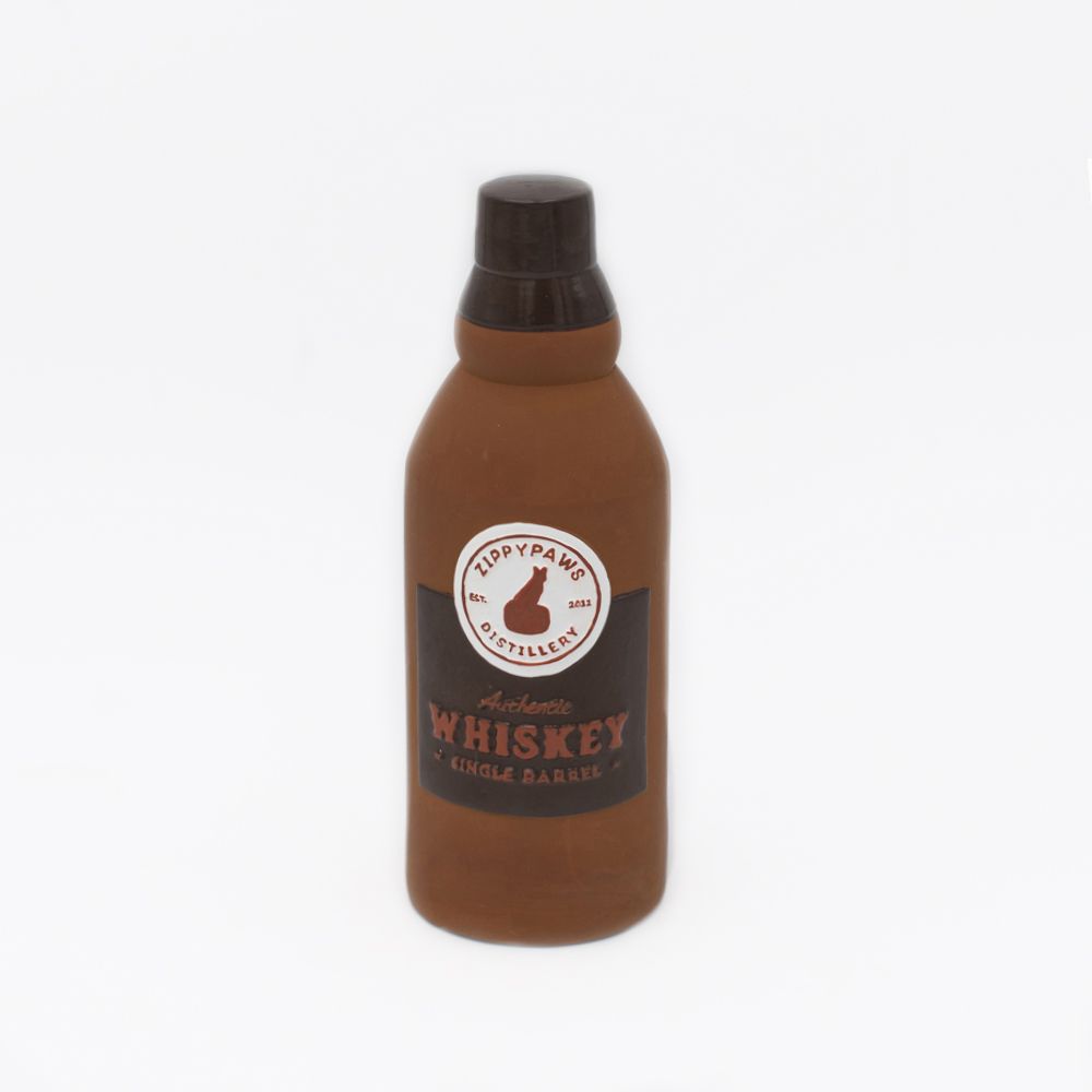 A dog toy shaped like a whiskey bottle, labeled "Latex Happy Hour Crusherz - Whiskey.