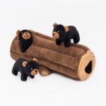 Zippy Burrow® - Black Bear Log, accompanied by three small, black bear plush toys, two standing on the log and one sitting at the opening.