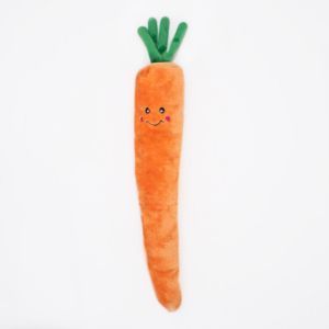 A Jigglerz® - Carrot shaped like an orange carrot with a smiling face, pink cheeks, and green leafy top. The background is plain white.