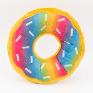A round, plush toy designed to look like a donut with rainbow-colored icing and white sprinkle decorations, set against a white background, the **Jumbo Donutz - Rainbow** is a delightful and whimsical treat for all ages.