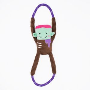 A Halloween RopeTugz® - Zombie featuring a stuffed green and brown character with pink hair and one stitched eye, designed for tugging and chewing.