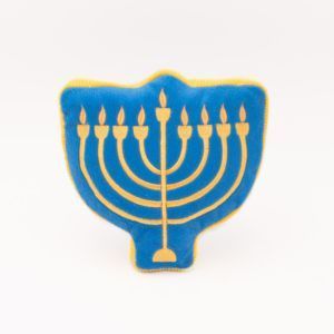 A blue Hanukkah Squeakie Pattiez - Menorah shaped like a menorah with nine yellow candles embroidered on it.