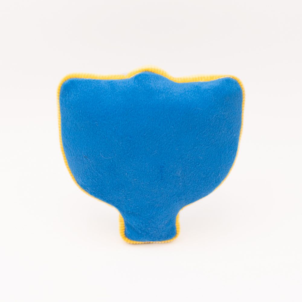 A blue, plush toy with yellow trim resembling a stylized, abstract shape is shown against a plain white background.