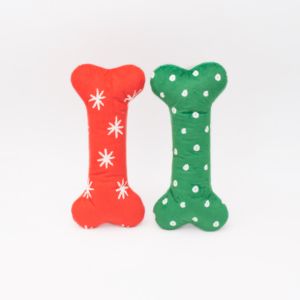 Two Holiday Patterned Bones - Large 2-Pack, one red with white snowflakes and one green with white polka dots, placed side by side against a plain white background.