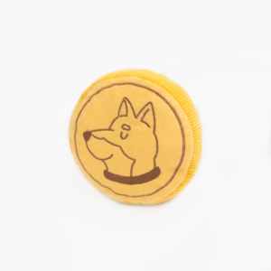 A yellow circular plush toy featuring an embroidered image of a dog's head in profile, Squeakie Pattiez - Zippy Coin.
