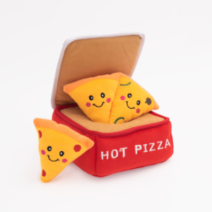 A red box labeled "Zippy Burrow® - Pizza Box" with a lid contains three plush toy pizza slices with smiley faces. One slice is detached from the box.