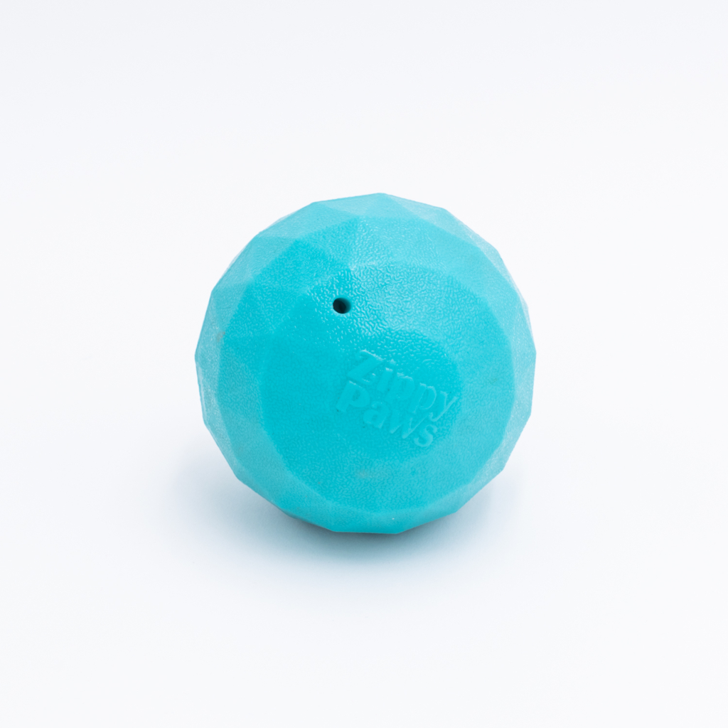 A turquoise, textured ball with the text 
