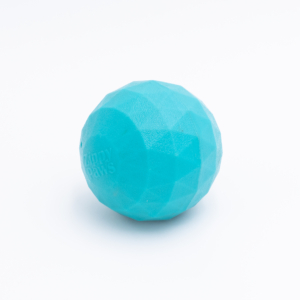 A textured, blue, egg-shaped ZippyTuff - Waggle Ball Jumbo against a white background.