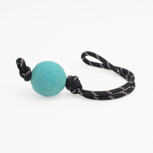 A ZippyTuff - Waggle Ball RopeTugz®, commonly used as a dog toy, is placed on a white background.