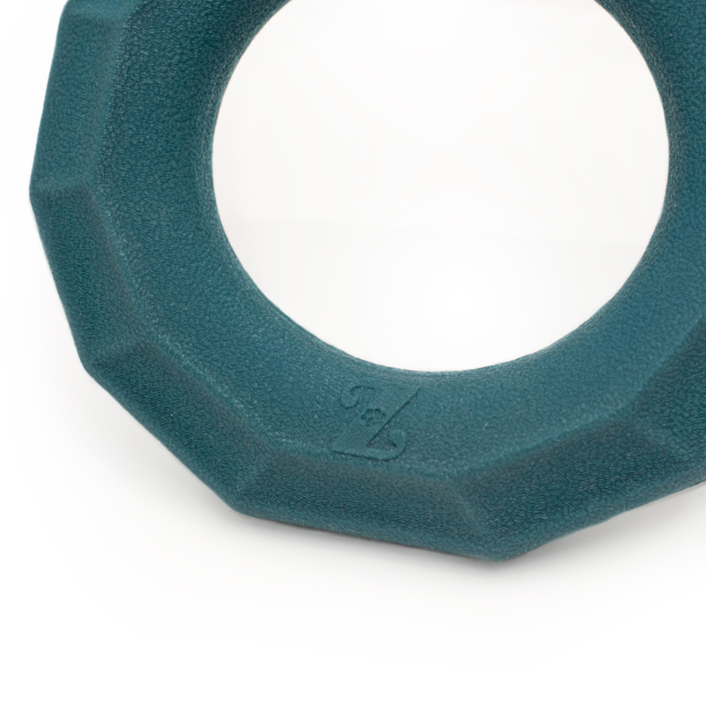 A teal, textured ZippyTuff+ Emerald Ring with an embossed design near its edge on a plain white background.