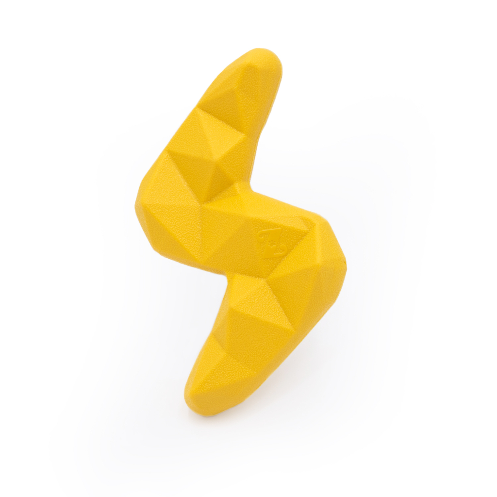 A yellow, geometric, ZippyTuff+ Lightning Bolt climbing hold with faceted surfaces set against a white background.